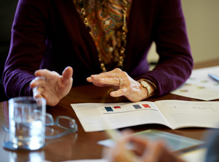 financial advisors hands at conference table